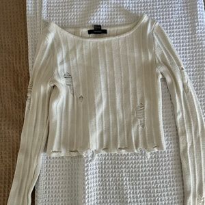 Distressed cropped sweater
